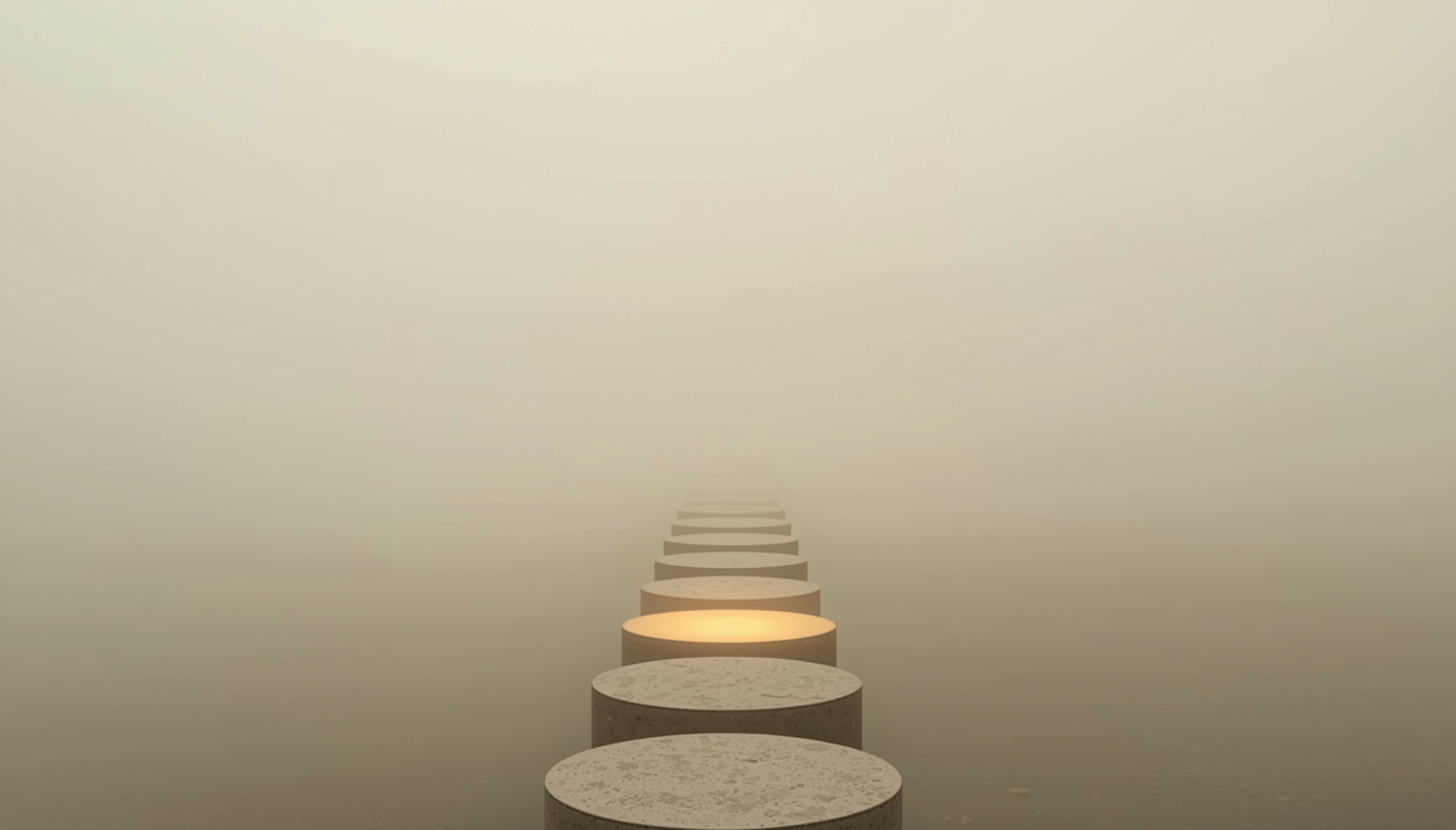 Stepping stones fading into fog, representing moving forward one small step at a time without needing to see the whole path.